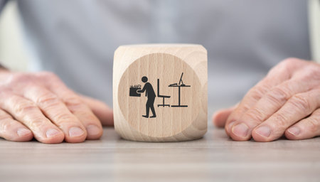 Wooden block with symbol of job loss conceptの写真素材