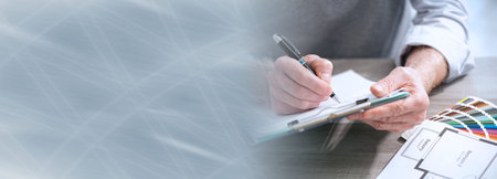 Architect working on a project in office; panoramic bannerの写真素材