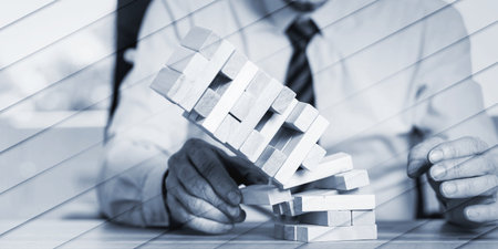 Concept of economy crash with domino tower, geometric patternの写真素材