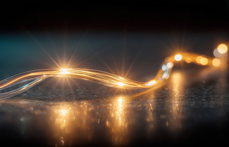 Elegant light trails create a captivating illumination on a dark reflective surfaceの素材