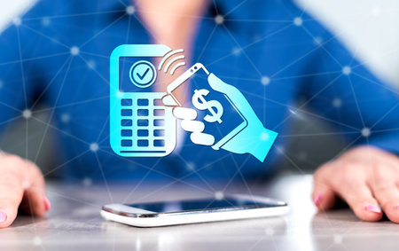 Smartphone with mobile payment concept between hands of a woman in backgroundの写真素材