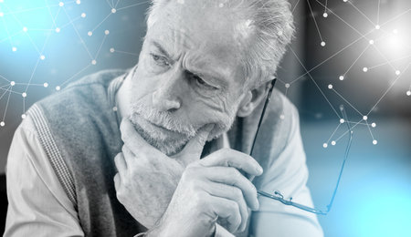 Portrait of thoughtful senior businessman; light effectの写真素材