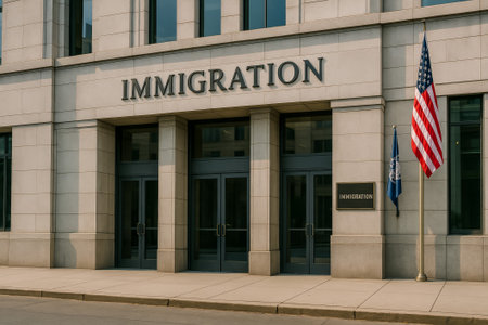 A modern immigration office featuring prominent signage and an American flag outside the entranceの素材