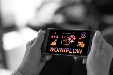 Smartphone screen displaying a workflow conceptの写真素材