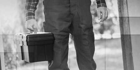 Repairman with his toolbox, light effect, geometric patternの写真素材