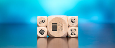 Wooden blocks with symbol of machine learning concept on blue backgroundの写真素材