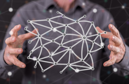 Virtual network concept between hands of a man in background