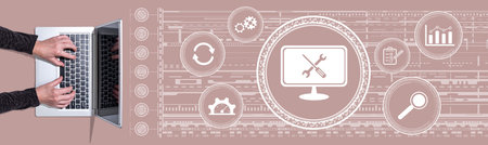 Top view of hands using laptop with symbol of system maintenance concept