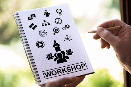 Hand drawing workshop concept on a notepad