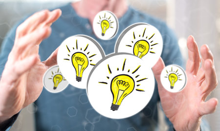 Innovation concept between hands of a man in background