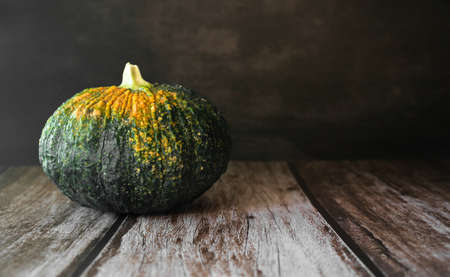 Thai pumpkin on black background and wood background, Thai fruitの写真素材
