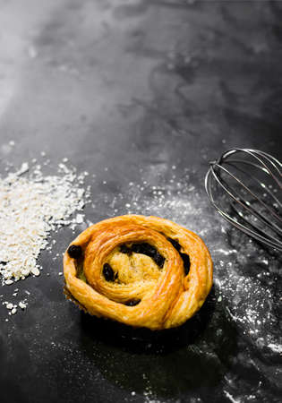 Raisin Bread on a black background, Cinnamon Roll, Butter and Raisin, Homemade Fresh Bakery Idea,...