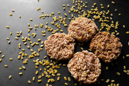 Thai Sweet Crispy Rice Cakes with Cane Sugar Drizzle on black background, Dessert in Thailandの写真素材