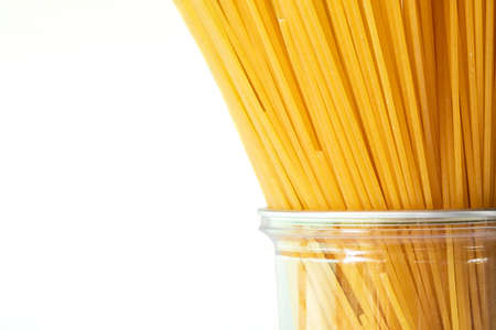 Yellow long spaghetti Yellow pasta isolated on white background,  Italian food and menu concept,...