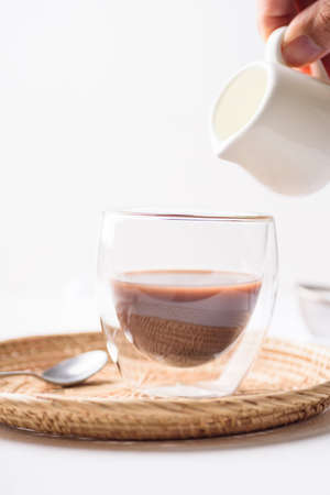 hot chocolate in a glass on a white backgroundの写真素材