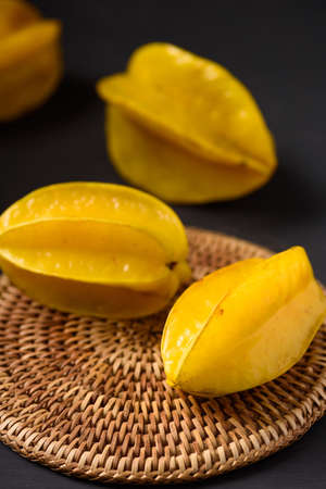 Star fruit on black background. Organic fruit from Thai farmer in local marketの写真素材
