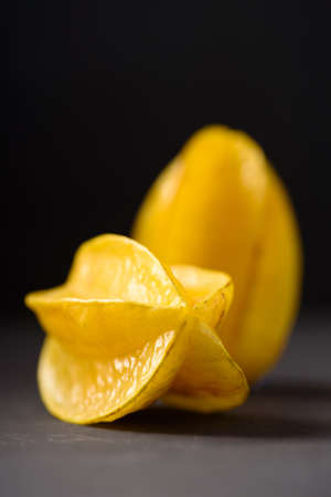 Star fruit on black background. Organic fruit from Thai farmer in local marketの写真素材
