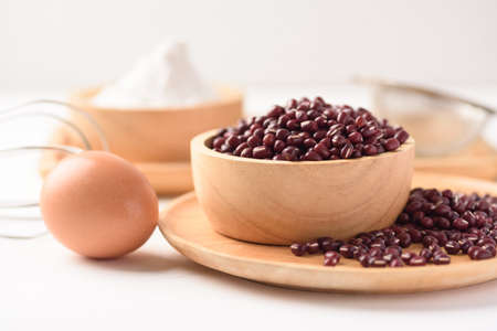 Azuki bean and wheat flour on white background. Natural organic products, healthy baking ingredientsの写真素材