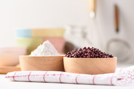 Azuki bean and wheat flour on white background. Natural organic products, healthy baking ingredientsの写真素材
