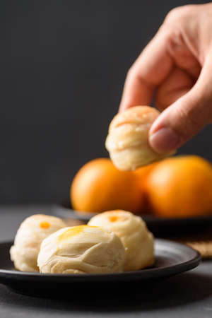 Thai mooncake or Chinese pastry on black backgroundの写真素材