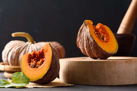 Organic Asian local pumpkin from Thai farm on black backgroundの写真素材