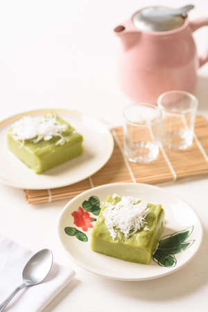 Pandanus pudding with coconut topping on white background, Traditional sweets that are cultural heritage of Asia.の写真素材