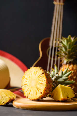 Pineapple from local market on black background, summer vacation beach ideaの写真素材