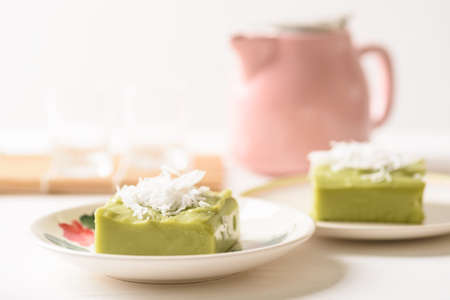 Pandanus pudding with coconut topping on white background, Traditional sweets that are cultural heritage of Asia.の写真素材