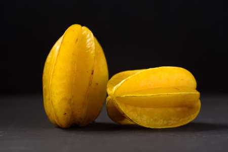 Star fruit on black background. Organic fruit from Thai farmer in local marketの写真素材