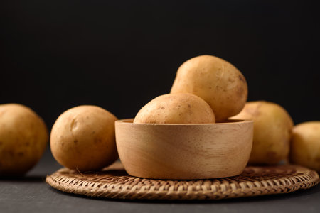 Organic potato from Thai farmer  local market on black backgroundの写真素材