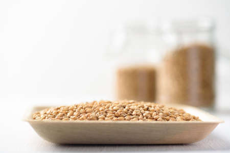 Whole wheat seedl on white background. Natural product, healthy baking ingredient