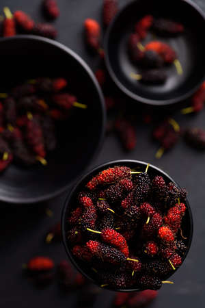 Mulberry fruit from local market on black background, Tropical fruit in spring and summer seasonの写真素材