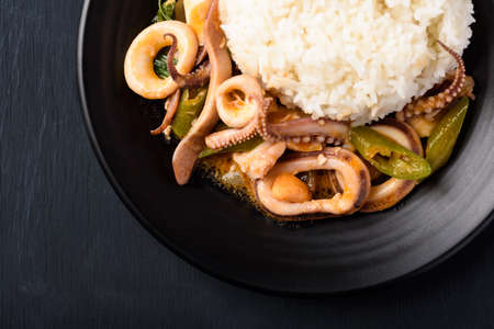 Stir fried squid with salted egg york and cooked rice, Thai food