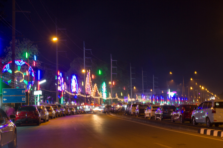Multi-colored lights are on the streets in big cities in Thailand.の写真素材