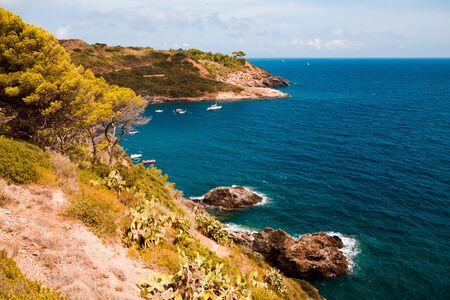Porto Azzuro, Elba Island,  Italy - August, 2011: The Barbarossa beach neer Port in Porto Azzurro on Elba Island, Italy on August, 2011.のeditorial素材