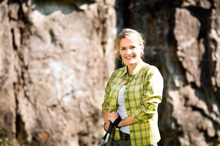 young woman hiking in the mountains