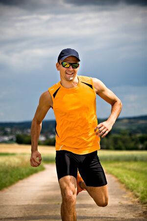 man jogging through the fields