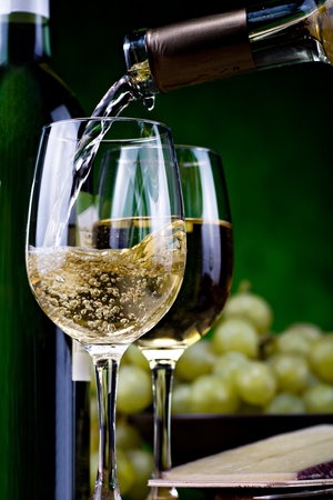 still life with bottle of white wine and cheeseの写真素材