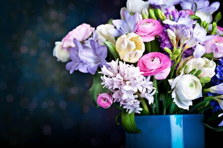 bunch of freesias, tulips, ranunculus and hyacinths