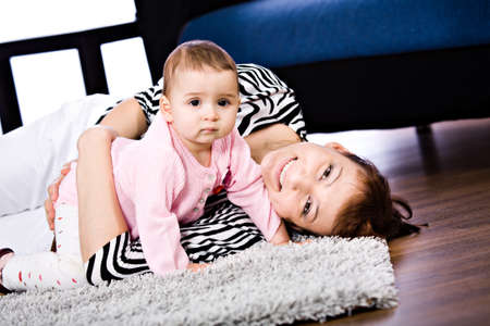 a mother and baby daughter studio portraitの写真素材