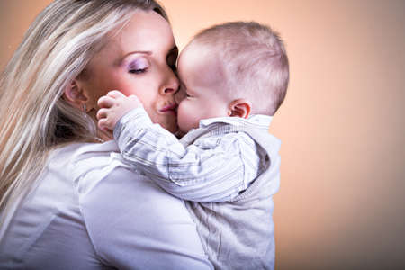 a mother and baby son studio portraitの写真素材