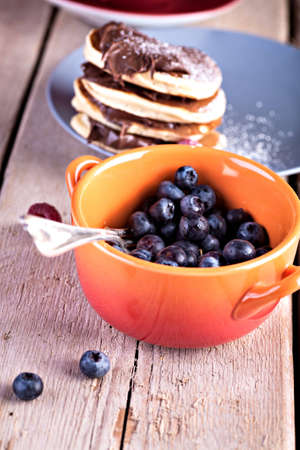 a plate with pancakes and raspberriesの写真素材