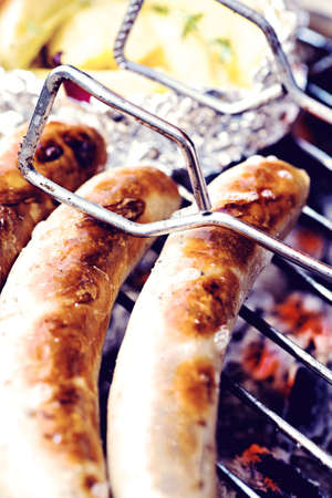 close up shut of sausages on the grillの写真素材