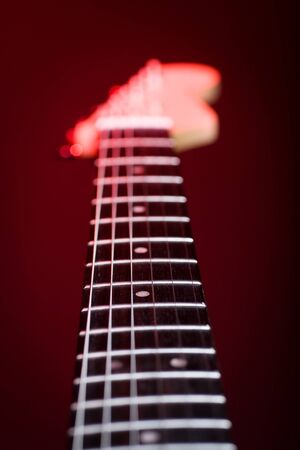 A close up shut of a red guitarの写真素材