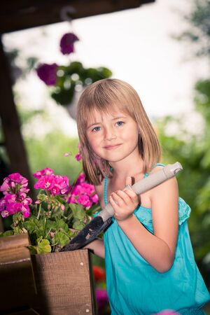 young girl working in the gardenの写真素材