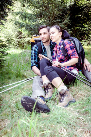 young couple hiking in the wilde nature