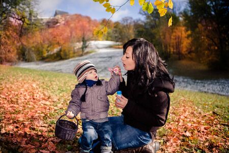 a young mother with a boy in a park