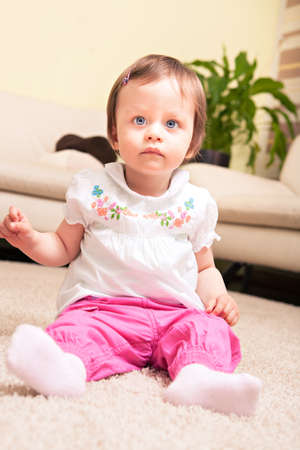 little toddler playing in the child's roomの写真素材