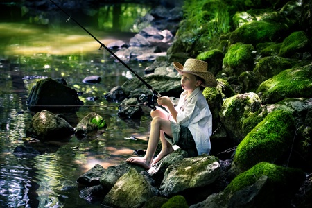outdoor portrait of a young fishing boyの写真素材