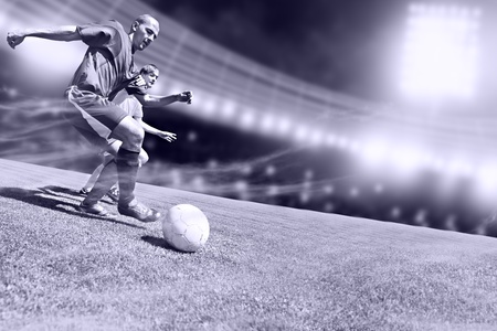 two football players from opposing team on the fieldの写真素材